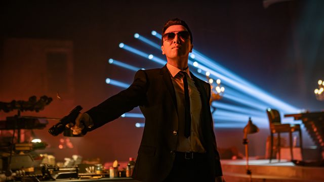 Donnie Yen looks dope as fuck, wearing a suit with a skinny tie, sunglasses, and firing a gun in John Wick: Chapter 4.