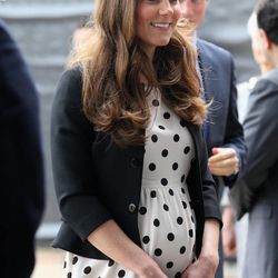 Britain's Kate the Duchess of Cambridge arrives with her husband Prince William, not pictured and his brother Prince Harry, rear right, to attend the inauguration of "Warner Bros. Studios Leavesden" near Watford, approximately 18 miles north west of central London, Friday, April 26, 2013.