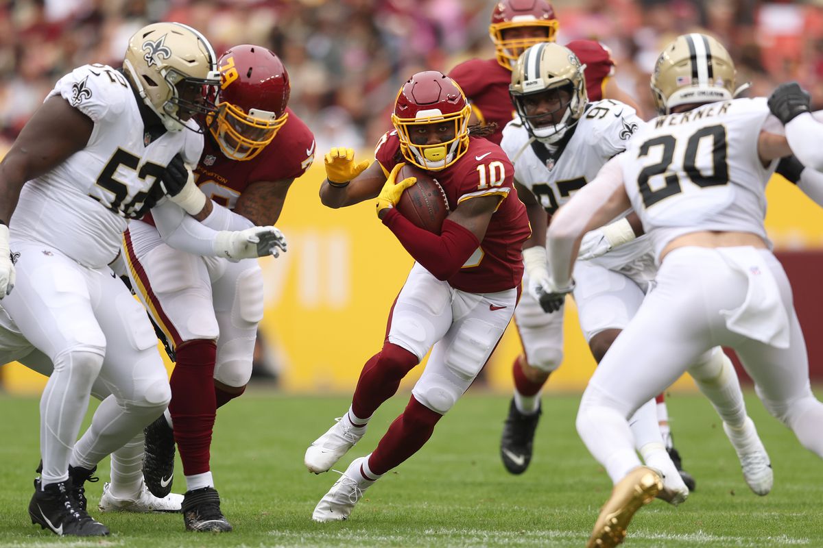 Curtis Samuel #10 of the Washington Football Team runs with the ball during the first half a New Orleans Saints at FedExField on October 10, 2021 in Landover, Maryland.