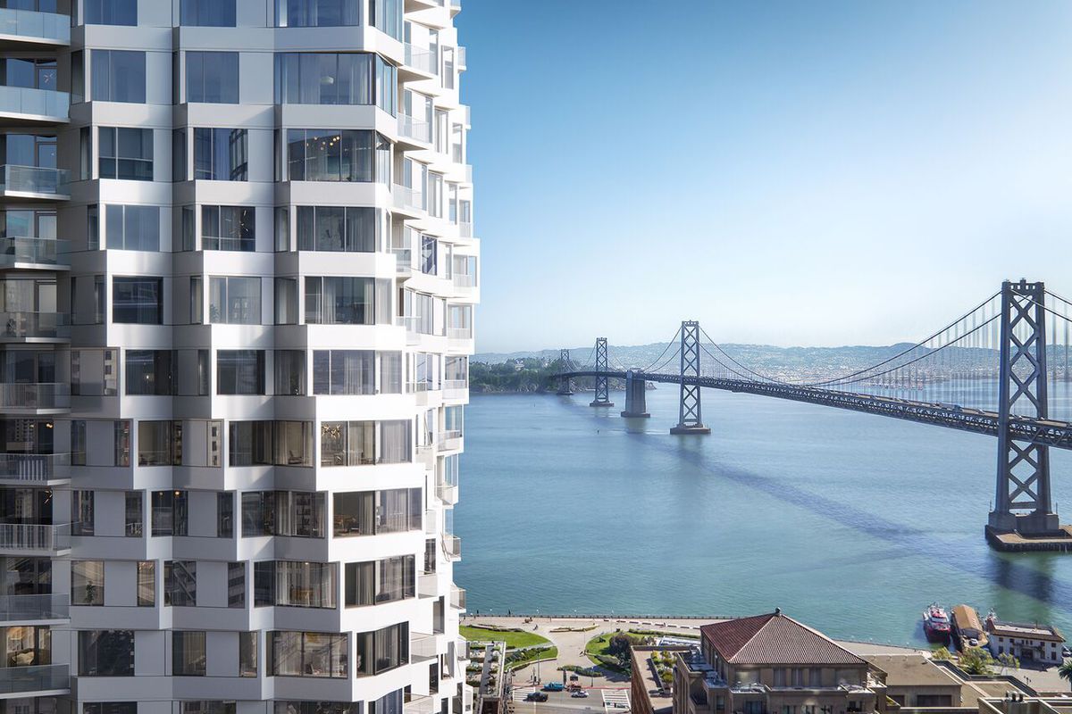 A rendering of an SF building with a rippling facade right in front of the Bay Bridge.