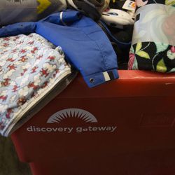 New coats, blankets and towels are collected during the third annual Share the Warmth event at Discovery Gateway in Salt Lake City on Thursday, Feb. 12, 2015. Guests were invited to bring in a new or gently used blanket or coat for families at the Road Home in exchange for one free admission per donation.
