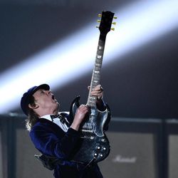 Angus Young of AC/DC performs at the 57th annual Grammy Awards on Sunday, Feb. 8, 2015, in Los Angeles. 