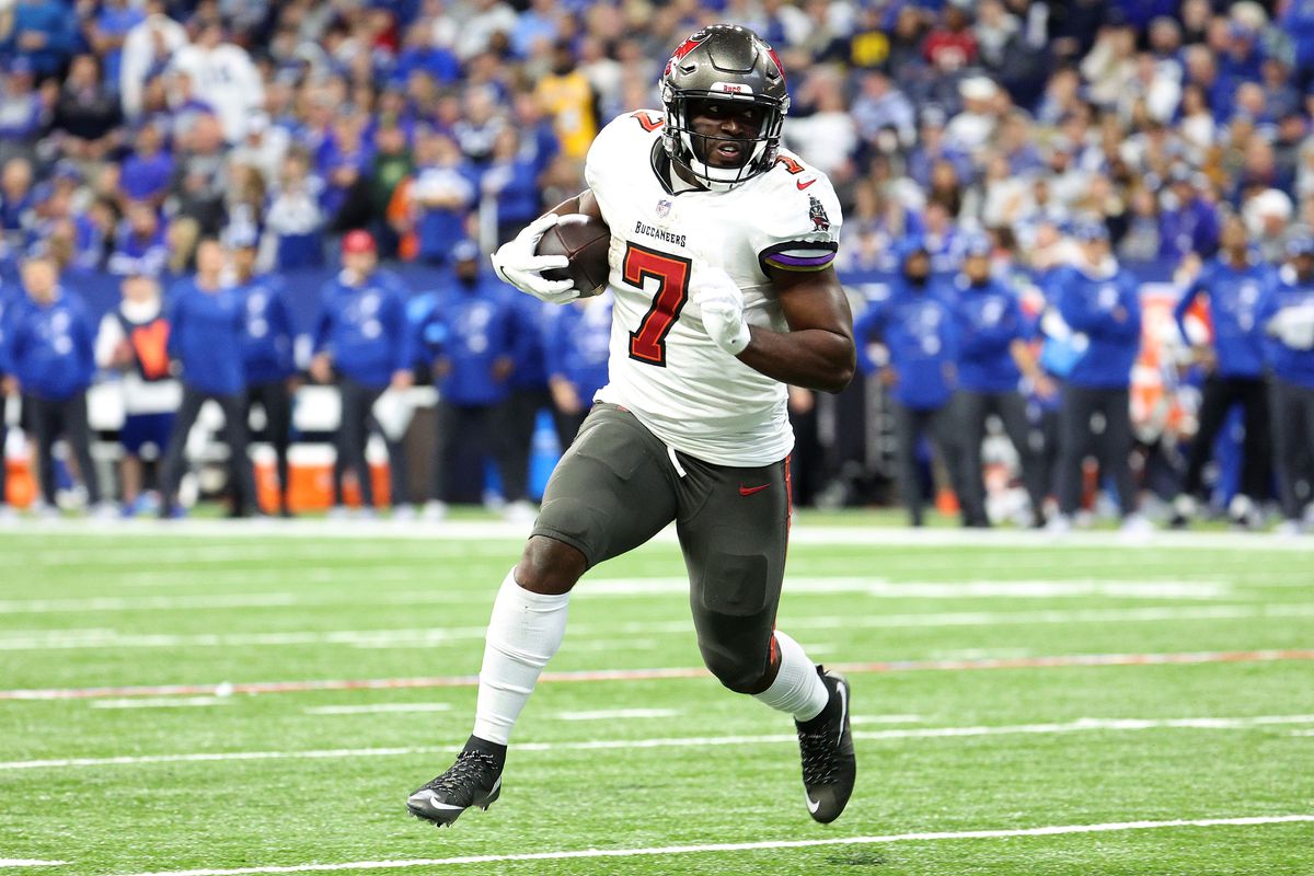 Leonard Fournette #7 of the Tampa Bay Buccaneers carries the ball down the field in the fourth quarter of the game against the Indianapolis Colts at Lucas Oil Stadium on November 28, 2021 in Indianapolis, Indiana.