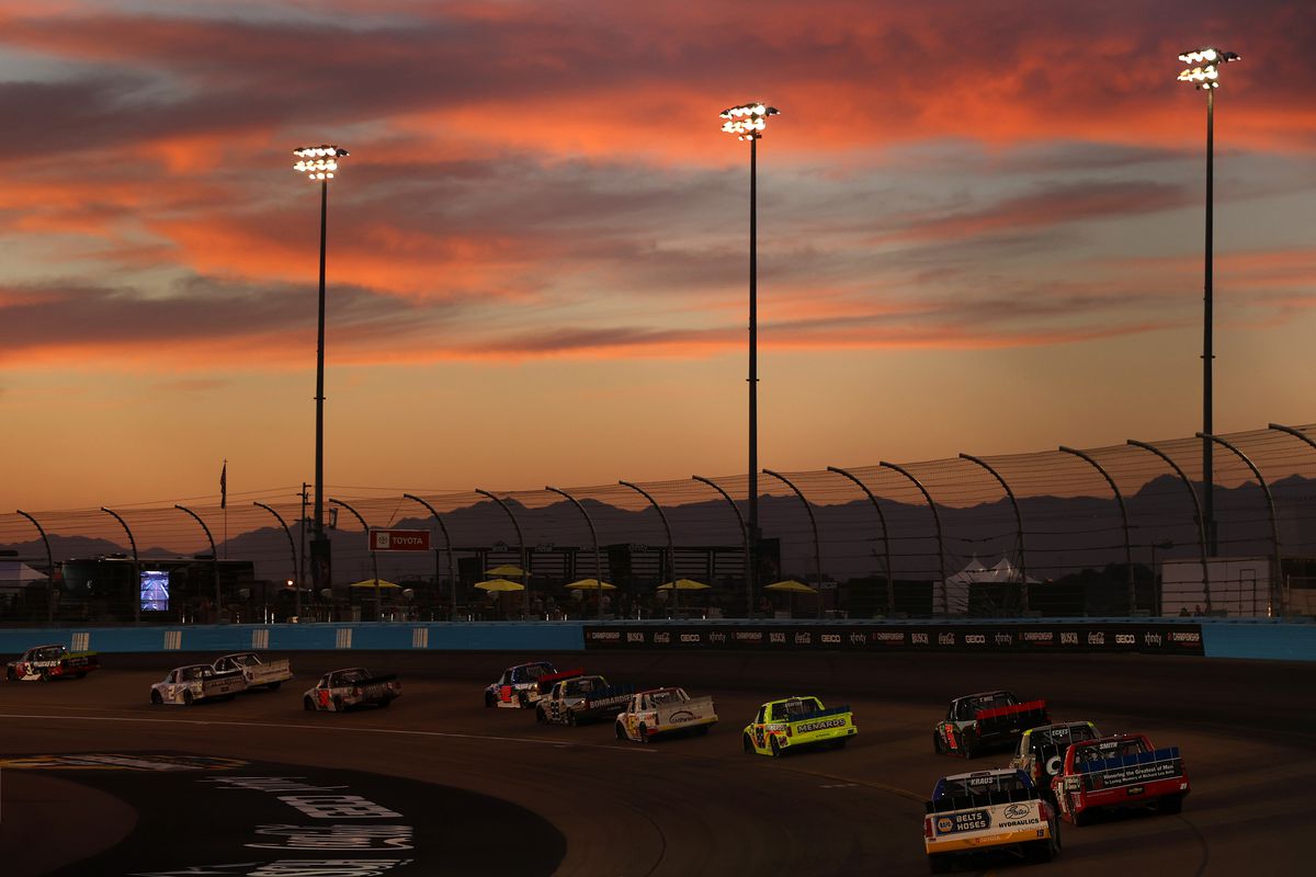 A general view of racing as the sun sets during the NASCAR Camping World Truck Series Lucas Oil 150 at Phoenix Raceway on November 05, 2021 in Avondale, Arizona.
