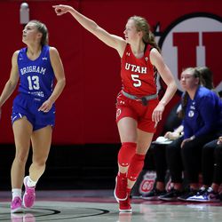 Utah Utes guard Gianna Kneepkens (5) celebrates after a three point shot as Utah and BYU women compete in a basketball game at the Huntsman Center in Salt Lake City on Saturday, Dec. 4, 2021.