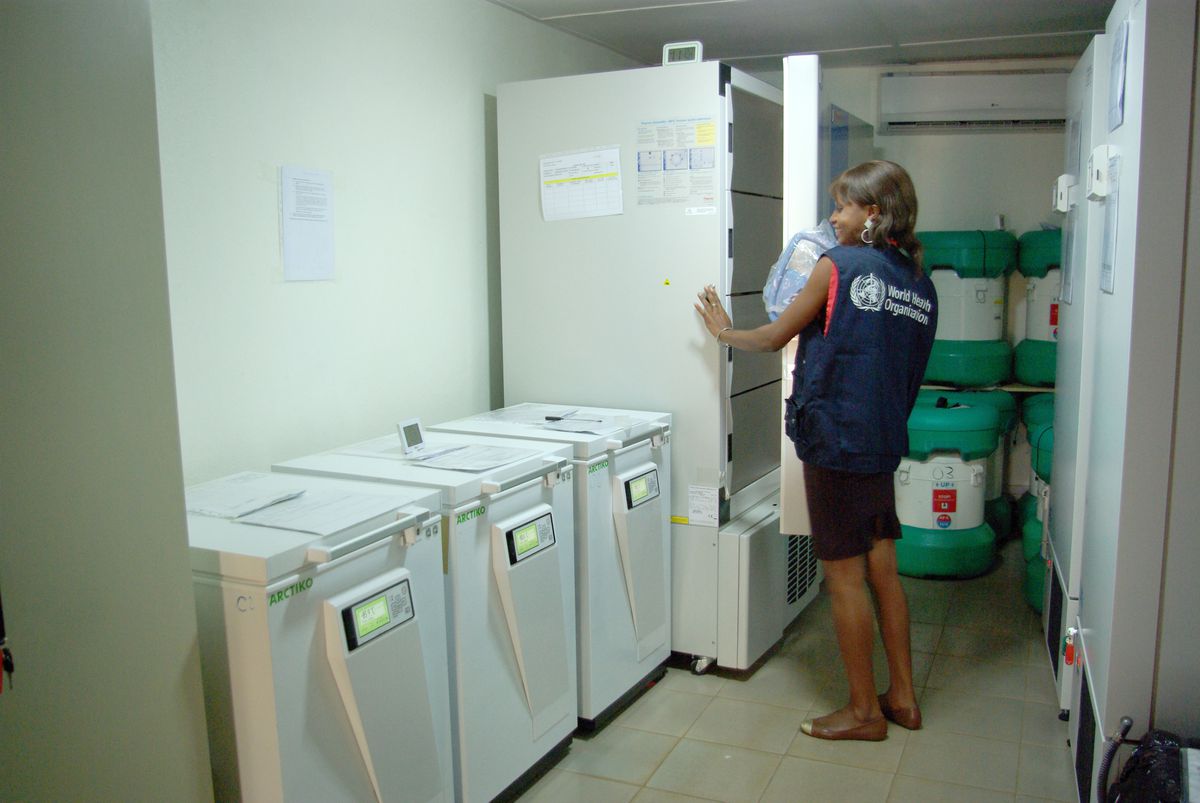 Sita Tozno, a specialist in cold storage from the World Health Organisation (WHO)&nbsp;makes sure that the temperature of the ebola vaccine in special containers does not rise above minus 80 degrees centigrade, in Conakry, Guinea, 10 November 2015.