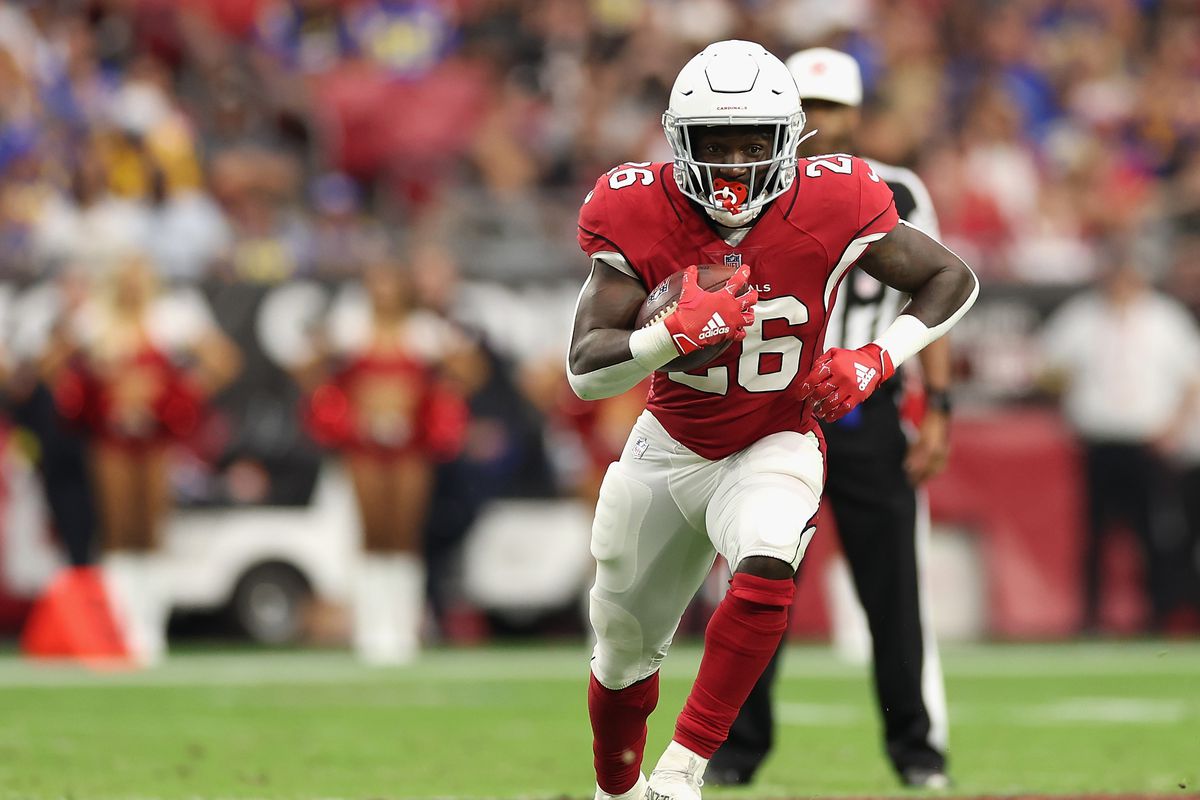 GLENDALE, ARIZONA - SEPTEMBER 25: Running back Eno Benjamin #26 of the Arizona Cardinals rushes the football against the Los Angeles Rams during the first half of the NFL game at State Farm Stadium on September 25, 2022 in Glendale, Arizona.