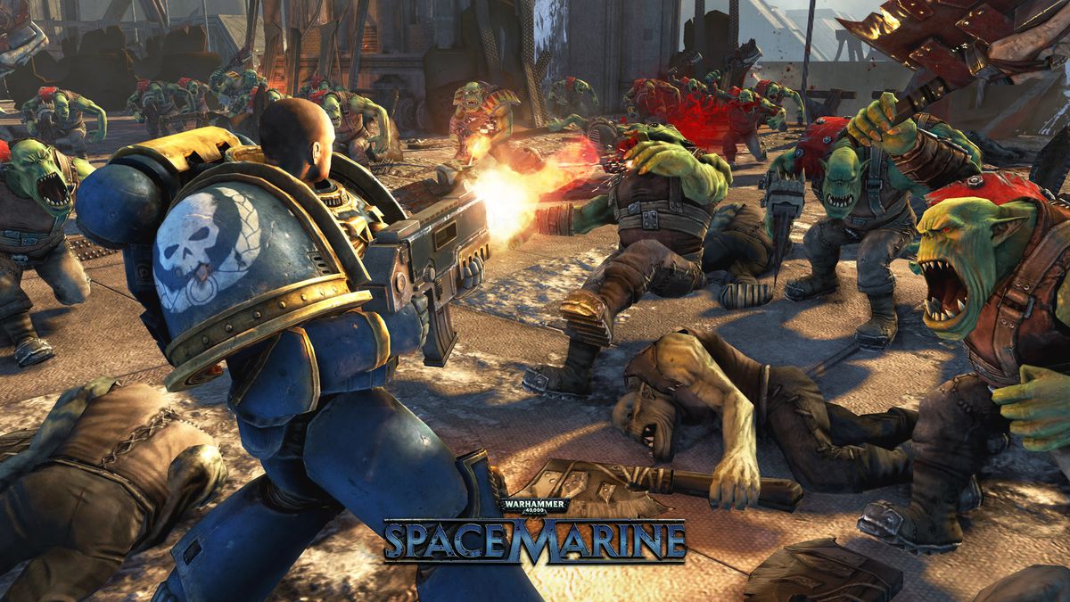 a heavily armored marine blasts away at oncoming Orks in a scene from Warhammer 40,000 Space Marine - Anniversary Edition