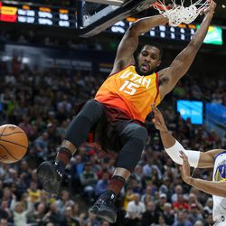 Utah Jazz forward Derrick Favors (15) dunks over Golden State Warriors forward David West (3) at Vivint Arena in Salt Lake City on Tuesday, Jan. 30, 2018.