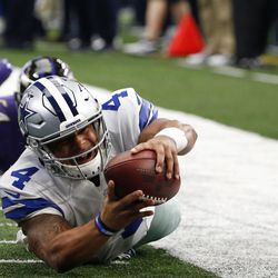 Dallas Cowboys quarterback Dak Prescott (4) leaps but falls shy of the end zone after being tripped up by Baltimore Ravens\' Zach Orr in the first half of an NFL football game, Sunday, Nov. 20, 2016, in Arlington, Texas. (AP Photo/Michael Ainsworth)
