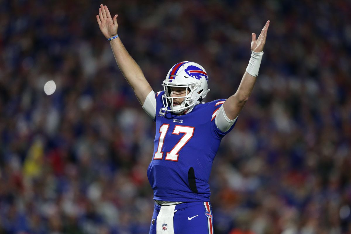 Josh Allen #17 of the Buffalo Bills signals for a touchdown during the first quarter against the Green Bay Packers at Highmark Stadium on October 30, 2022 in Orchard Park, New York.