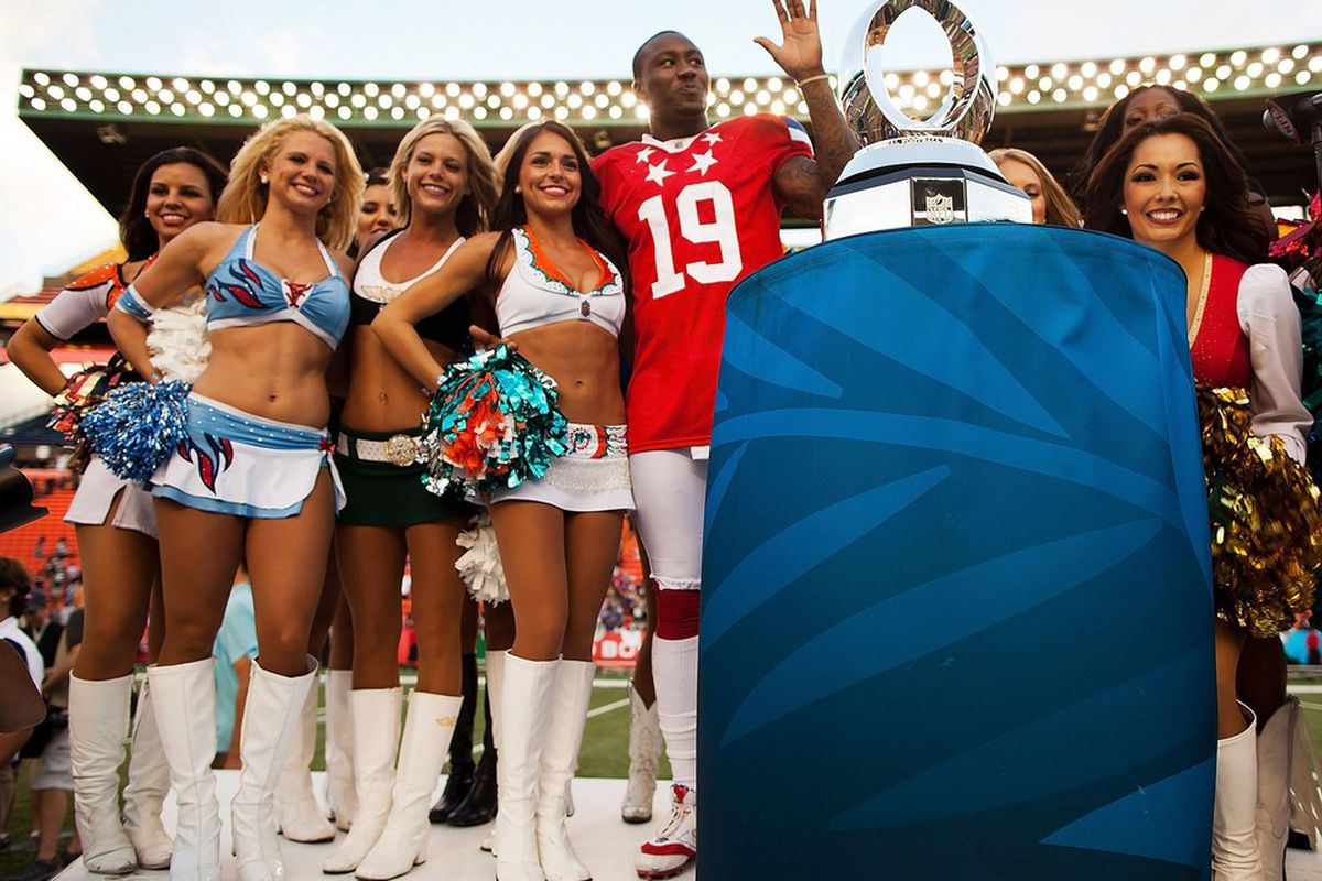 HONOLULU, HI - JANUARY 29:  Brandon Marshall #19 of the Miami Dolphins poses with the Pro Bowl Cheerleaders after the 2012 NFL Pro Bowl at Aloha Stadium on January 29, 2012 in Honolulu, Hawaii.  (Photo by Kent Nishimura/Getty Images)