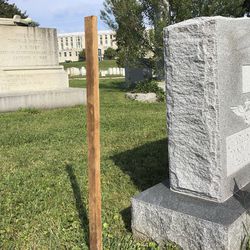 A wooden spike marks the spot, Saturday, Aug. 26, 2018 where Sen. John McCain, R-Ariz., will be buried on the grounds of the U. S. Navel Academy in Annapolis, Md. McCain is set to be buried next to his best friend, Adm. Chuck Larson, from his days at the U.S. Naval Academy _ and not in Arlington National Cemetery with his father and grandfather.   (AP Photo/Laurie Kellman)
