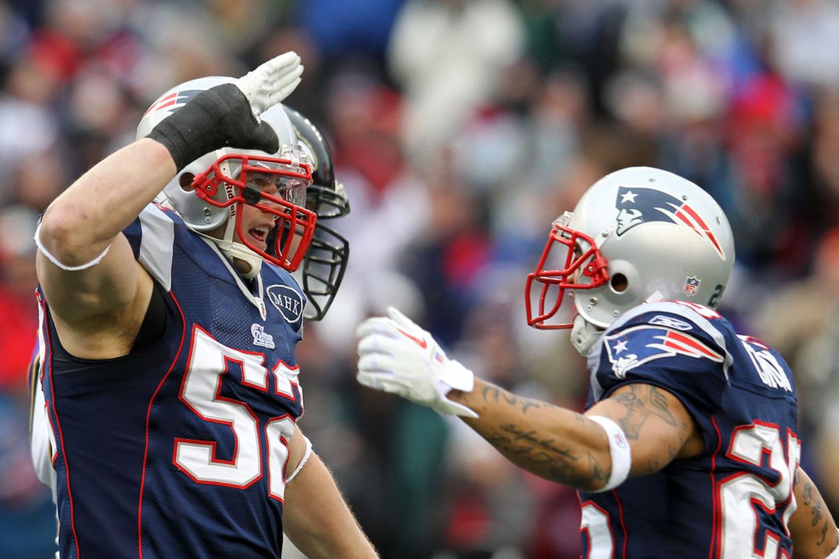 Dane Fletcher #52 of the New England Patriots celebrates with teammate Patrick Chung #25 during their AFC Championship Game against the New England Patriots at Gillette Stadium on January 22, 2012 in Foxboro, Massachusetts.