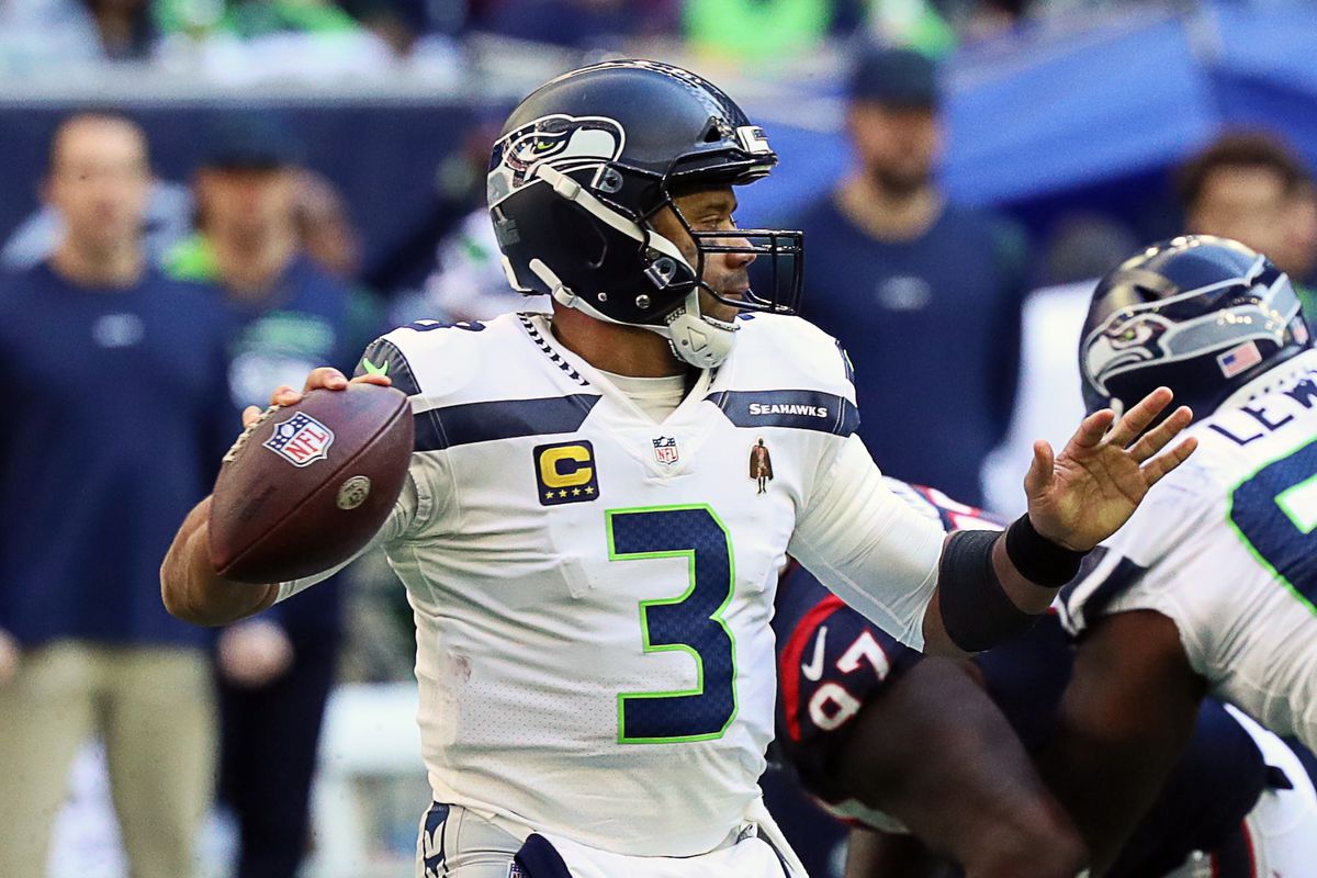Seattle Seahawks quarterback Russell Wilson #3 throws a pass against the Houston Texans at NRG Stadium on December 12, 2021 in Houston, Texas.