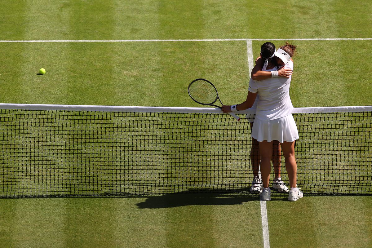 Match winner Ons Jabeur of Tunisia embraces Tatjana Maria of German at the net following their Women’s Singles Semi-Final match on day eleven of The Championships Wimbledon 2022 at All England Lawn Tennis and Croquet Club on July 07, 2022 in London, England.