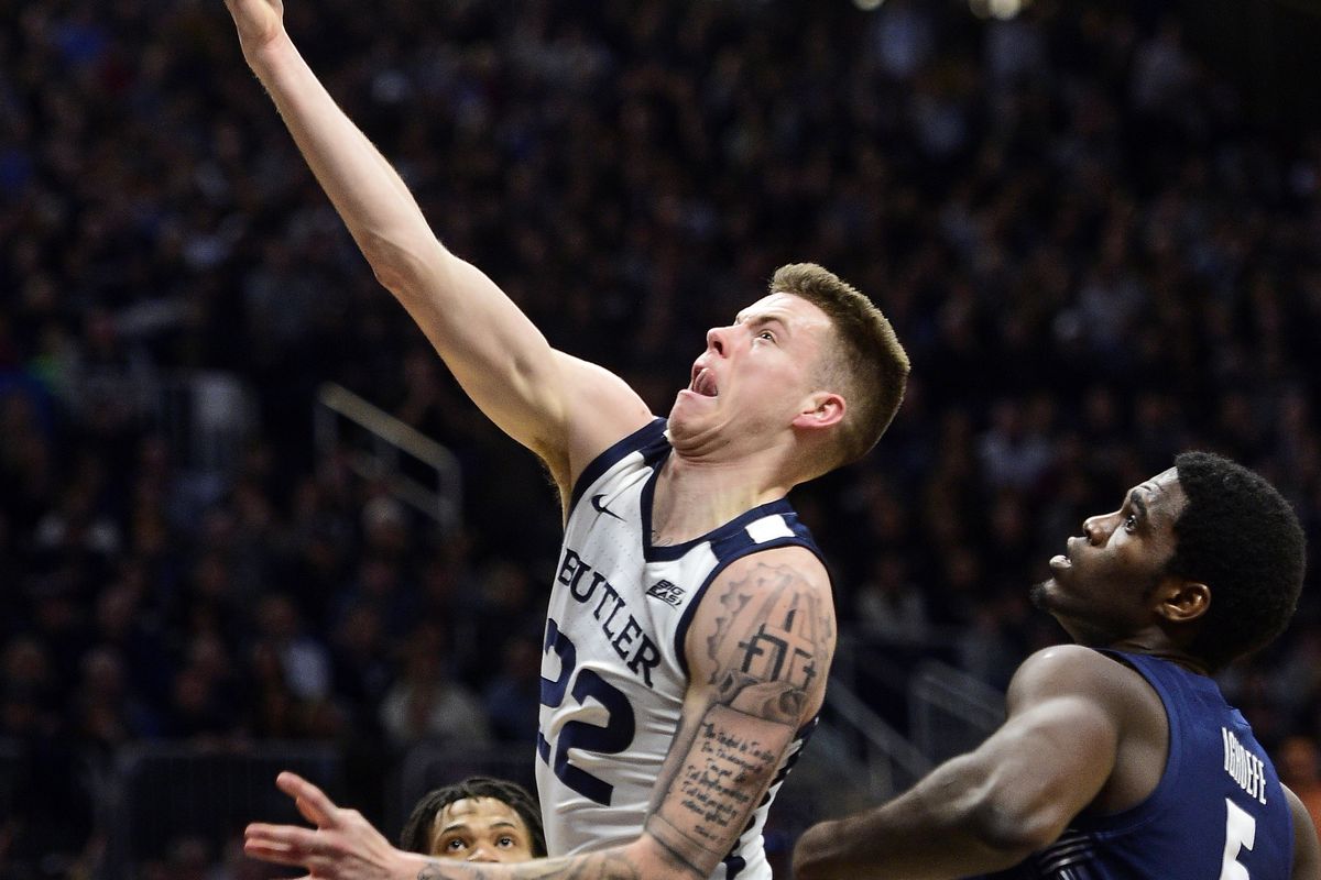 Butler Bulldogs forward Sean McDermott shoots the ball past past Georgetown Hoyas center Timothy Ighoefe at Hinkle Fieldhouse.