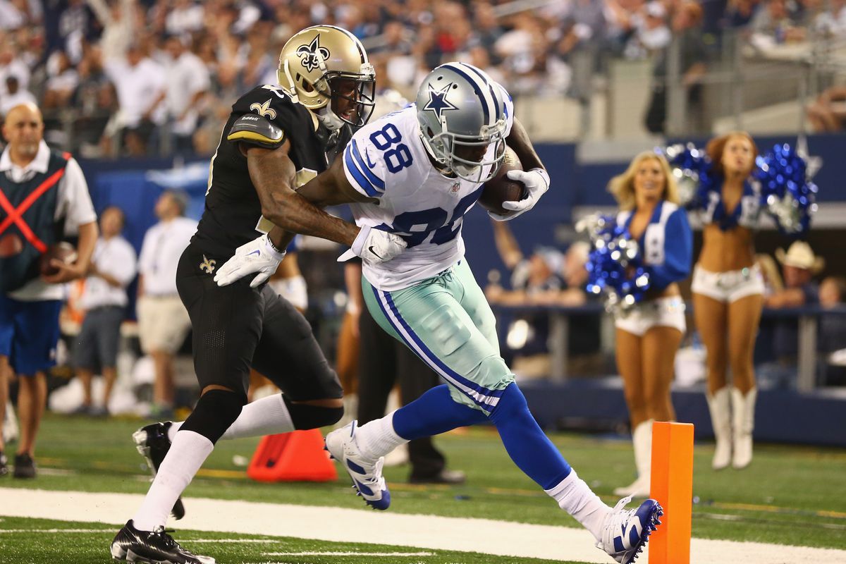 ARLINGTON, TX - New Orleans Saints cornerback Keenan Lewis (28) escorts Dallas Cowboys wide receiver Dez Bryant (88) into the end zone during a 2014 game at AT&amp;T Stadium.