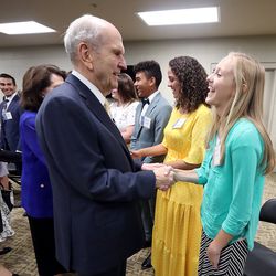 President Russell M. Nelson, talks with Natalie Smith prior to a devotional at the Amway Center in Orlando, Florida, on Sunday, June 9, 2019.