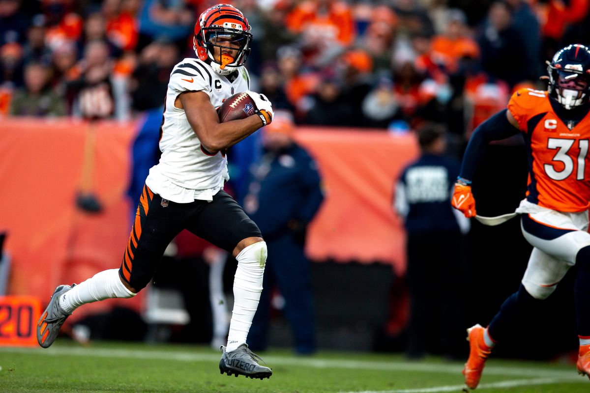 Cincinnati Bengals wide receiver Tyler Boyd (83) scores a touchdown in the second half of the NFL football game on Sunday, Dec. 19, 2021, at Empower Field in Denver. Cincinnati defeated the Broncos 15-10.