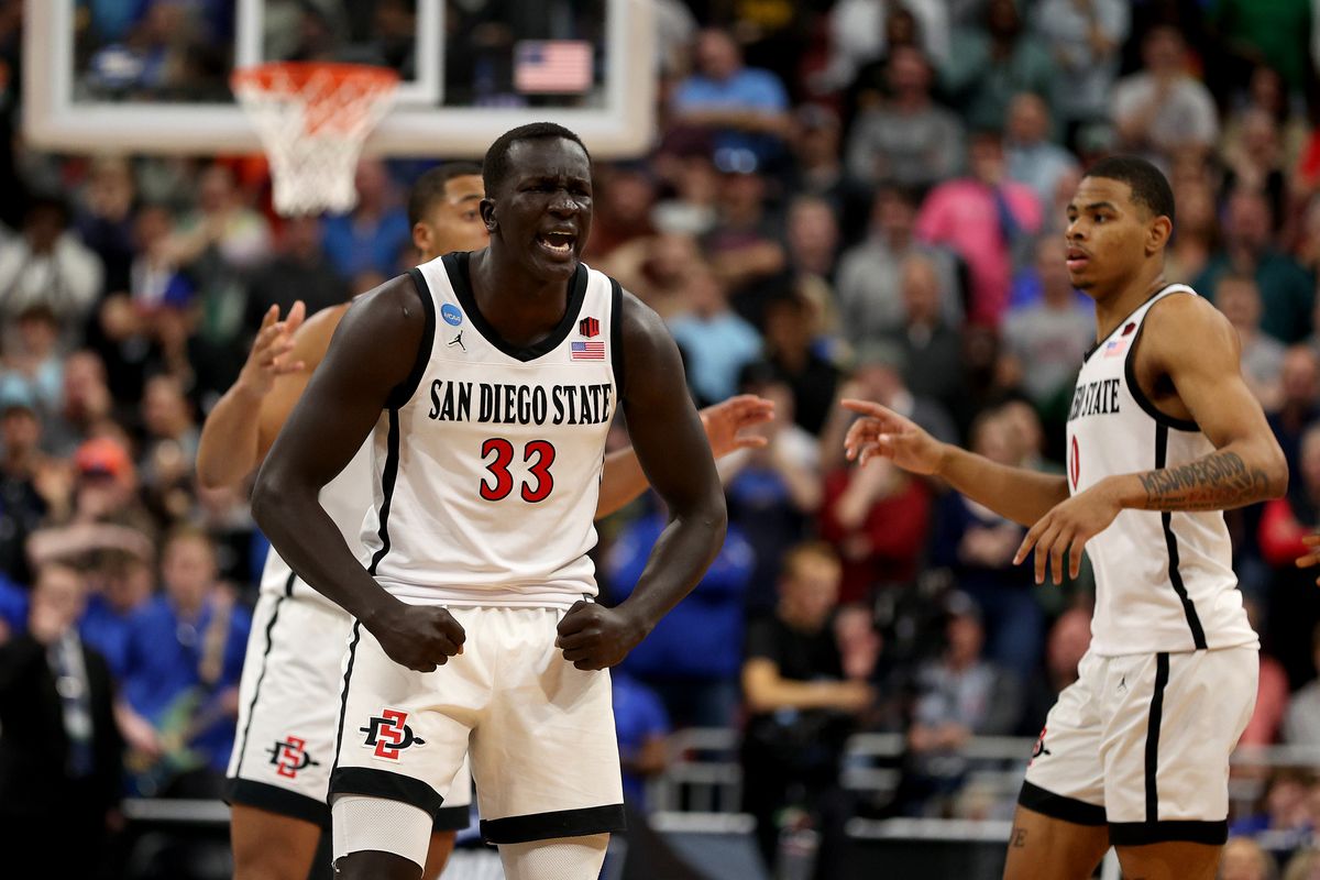 Aguek Arop of the San Diego State Aztecs celebrates against the Creighton Bluejays during the second half in the Elite Eight round of the NCAA Men’s Basketball Tournament at KFC YUM! Center on March 26, 2023 in Louisville, Kentucky.
