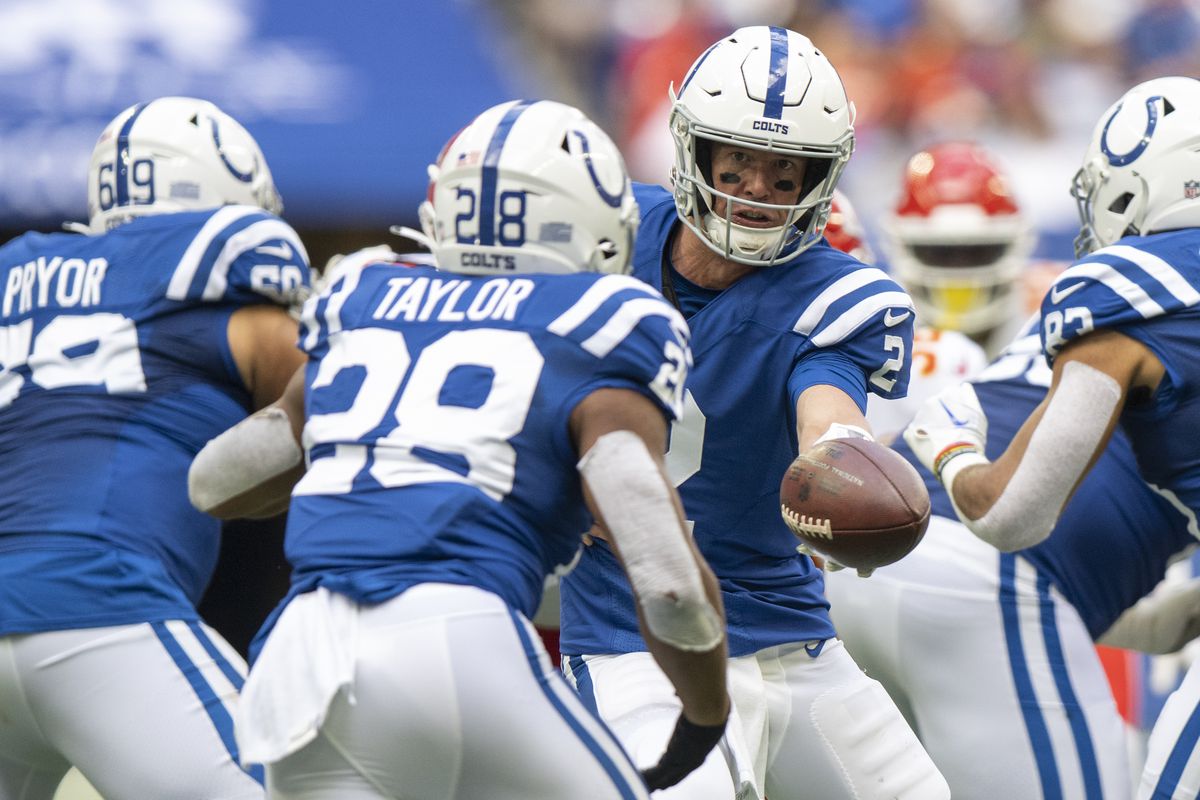 Indianapolis Colts quarterback Matt Ryan (2) hands the ball off to running back Jonathan Taylor (28) during the second half against the Kansas City Chiefs at Lucas Oil Stadium.