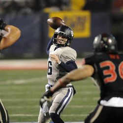 Utah State Aggies quarterback Darell Garretson (6) delivers a pass downfield during the Mountain West football championship game at Bulldog Stadium in Fresno, Calif., on Saturday, Dec. 7, 2013.