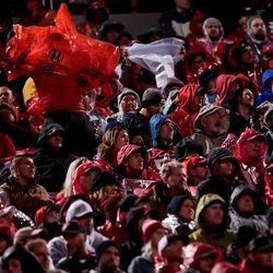 A Utah fan dons a poncho as rain picks up during the game against the Washington State Cougars at Rice-Eccles Stadium in Salt Lake City on Saturday, Sept. 28, 2019.