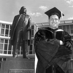 Steve Young and Great-great Granddad Brigham Young ham it up on Steve's graduation for Brigham Young University law school.