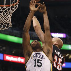 Utah Jazz forward Derrick Favors (15) goes up for a rebound against Portland Friday, Feb. 20, 2015, at EnergySolutions Arena in Salt Lake City. The Jazz beat the Blazers, 92-76.