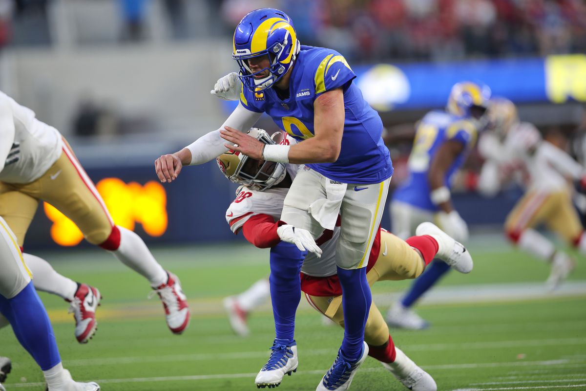 Arden Key #98 of the San Francisco 49ers hits Matthew Stafford #9 of the Los Angeles Rams during the game at SoFi Stadium on January 9, 2022 in Inglewood, California.
