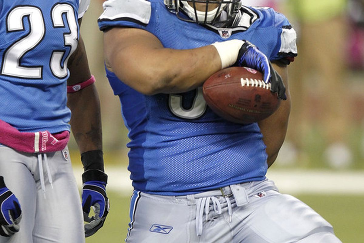 Ndamukong Suh f the Detroit Lions celebrates a fourth quarter interception against the St. Louis Rams.