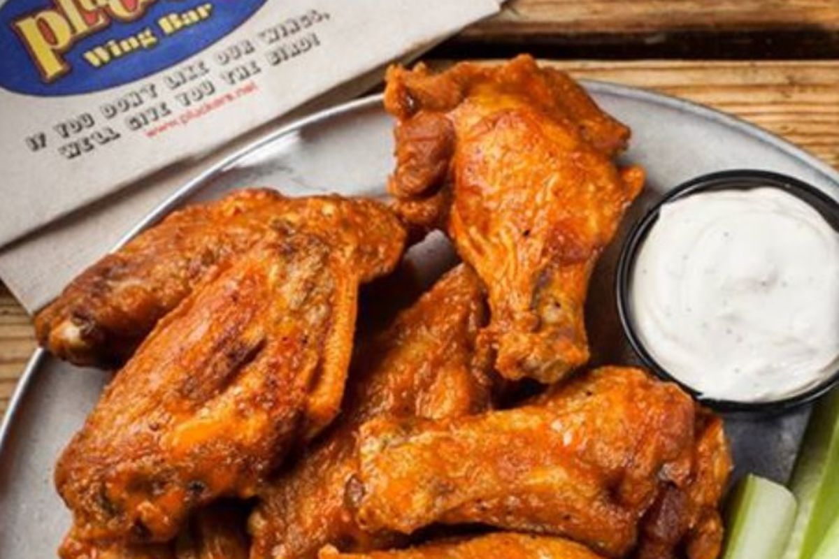 Partake of wings at rolled back pricing during Pluckers' 20th anniversary.