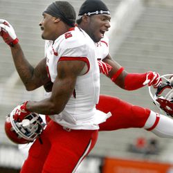 Kenneth Scott and Michael Walker celebrate Scott's touchdown during the Red-White game at Rice-Eccles Stadium at the University of Utah in Salt Lake City on Saturday, April 20, 2013.