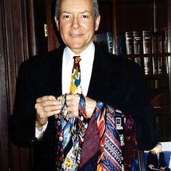 Sen. Orrin Hatch shows off one of his many ties. Hatch is noted for his many colorful ties that he picks up from his friend Mac Christensen, owner of Mr. Mac's in Utah. 