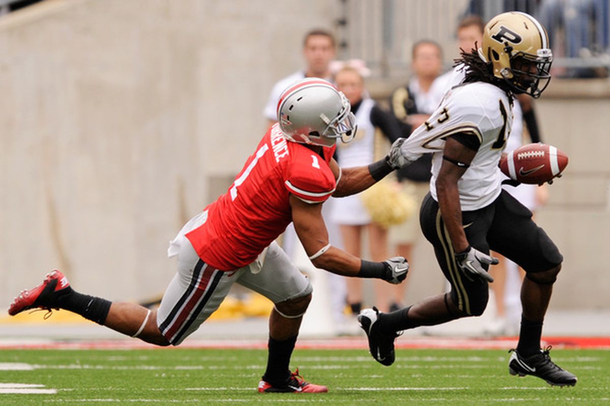 COLUMBUS OH - OCTOBER 23:  Devon Torrence #1 of the Ohio State Buckeyes hauls down Antavian Edison #13 of the Purdue Boilermakers by his shirt at Ohio Stadium on October 23 2010 in Columbus Ohio.  (Photo by Jamie Sabau/Getty Images)