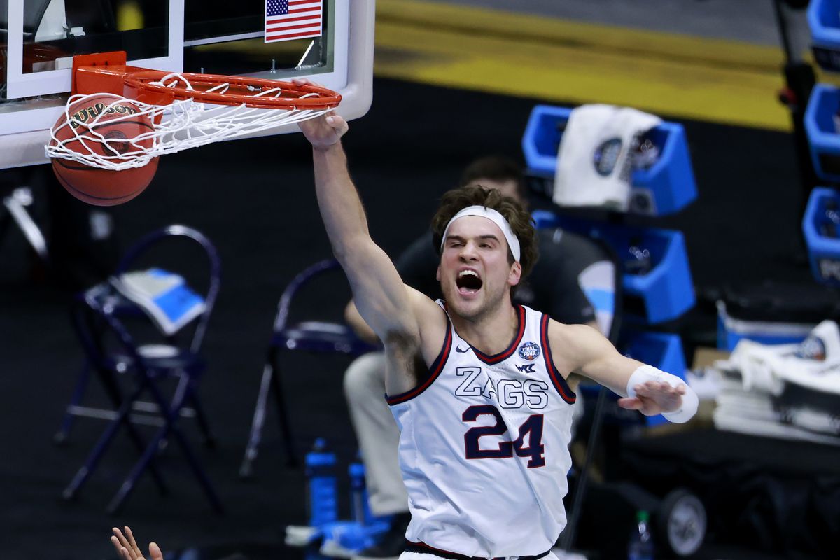 Corey Kispert of the Gonzaga Bulldogs dunks the ball against David Singleton #34 of the UCLA Bruins in the second half during the 2021 NCAA Final Four semifinal at Lucas Oil Stadium on April 03, 2021 in Indianapolis, Indiana.