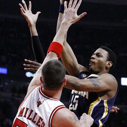 Indiana Pacers guard Brandon Rush, right, shoots over Chicago Bulls center Brad Miller during the first half.