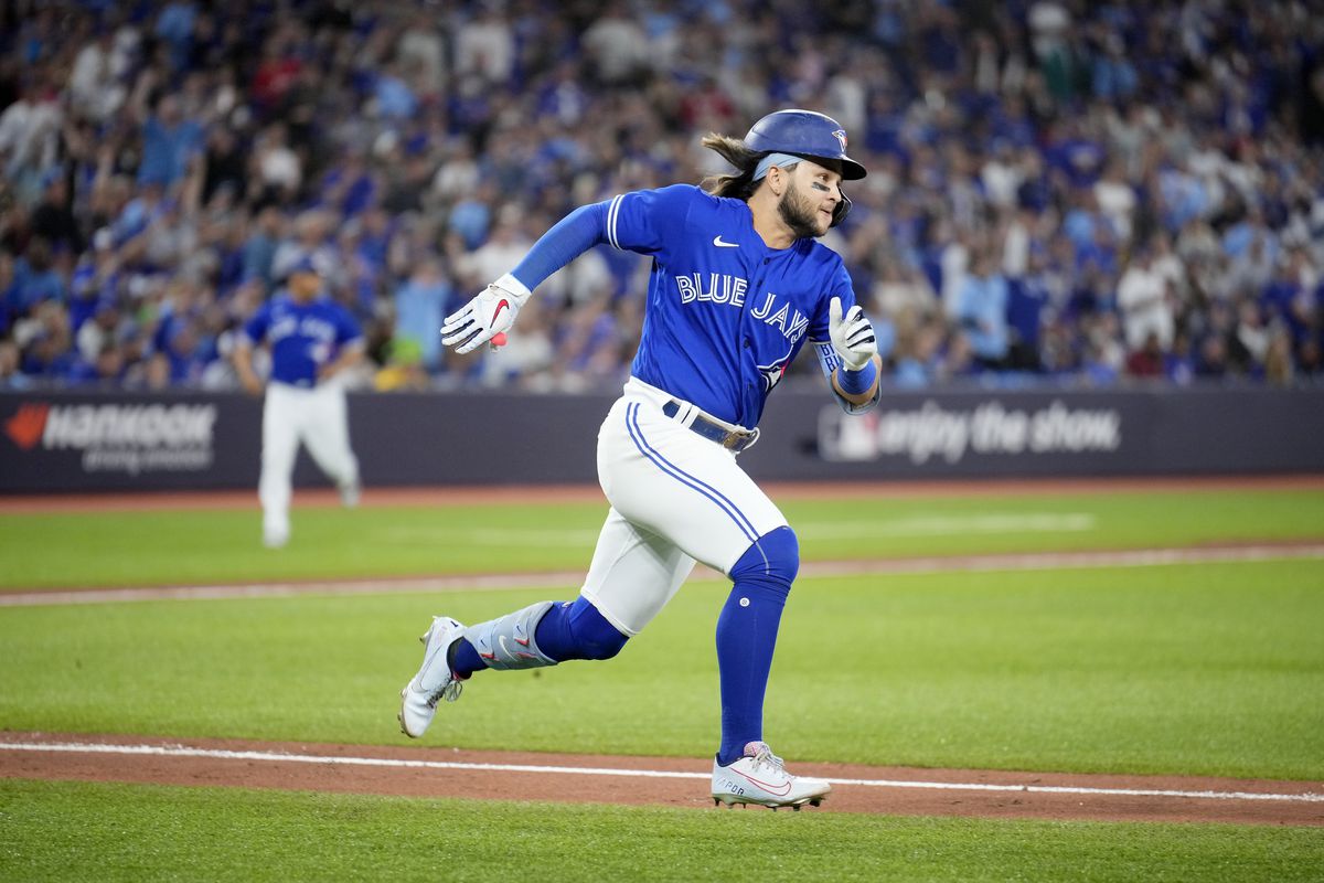 Bo Bichette #11 of the Toronto Blue Jays runs after hitting a double against the Seattle Mariners during the fifth inning in game two of the American League Wild Card Series at Rogers Centre on October 08, 2022 in Toronto, Ontario.