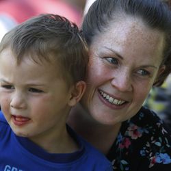 Anastasia Harman of Eagle Mountain hugs her son, Logan, 3, at This Is The Place Heritage Park in Salt Lake City on Friday, July 24, 2020. Due to the COVID-19 pandemic, the annual Days of ’47 parade was canceled, along with other Pioneer Day celebrations.
