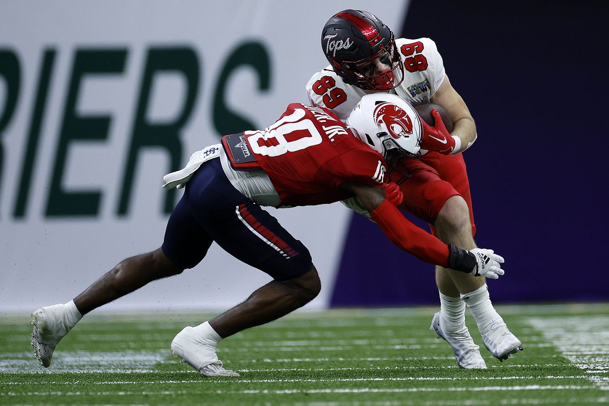 Joey Beljan #89 of the Western Kentucky Hilltoppers is tackled by Darrell Luter Jr. #18 of the South Alabama Jaguars during the R+L Carriers New Orleans Bowl at Caesars Superdome on December 21, 2022 in New Orleans, Louisiana.
