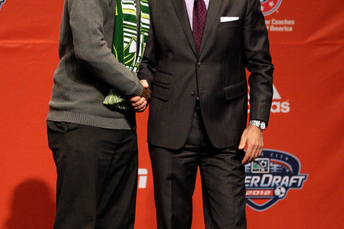 KANSAS CITY, MO:  Andrew Jean-Baptiste, selected eighth by the Portland Timbers, is greeted by MLS Commissioner Don Garber.