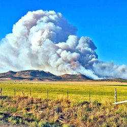 Smoke billows near Fairview, Sanpete County, on Saturday, June 23, 2012. The Wood Hollow Fire has burned more than 10,000 acres and forced the overnight evacuation of 200 homes.