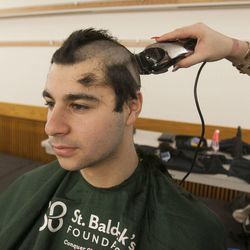 Maziar Nourian gets his head shaved at Salt Lake Community College as students take part Monday, April 1, 2013, in the St. Baldrick's Foundation signature head-shaving event to raise funds and awareness for lifesaving childhood cancer research.