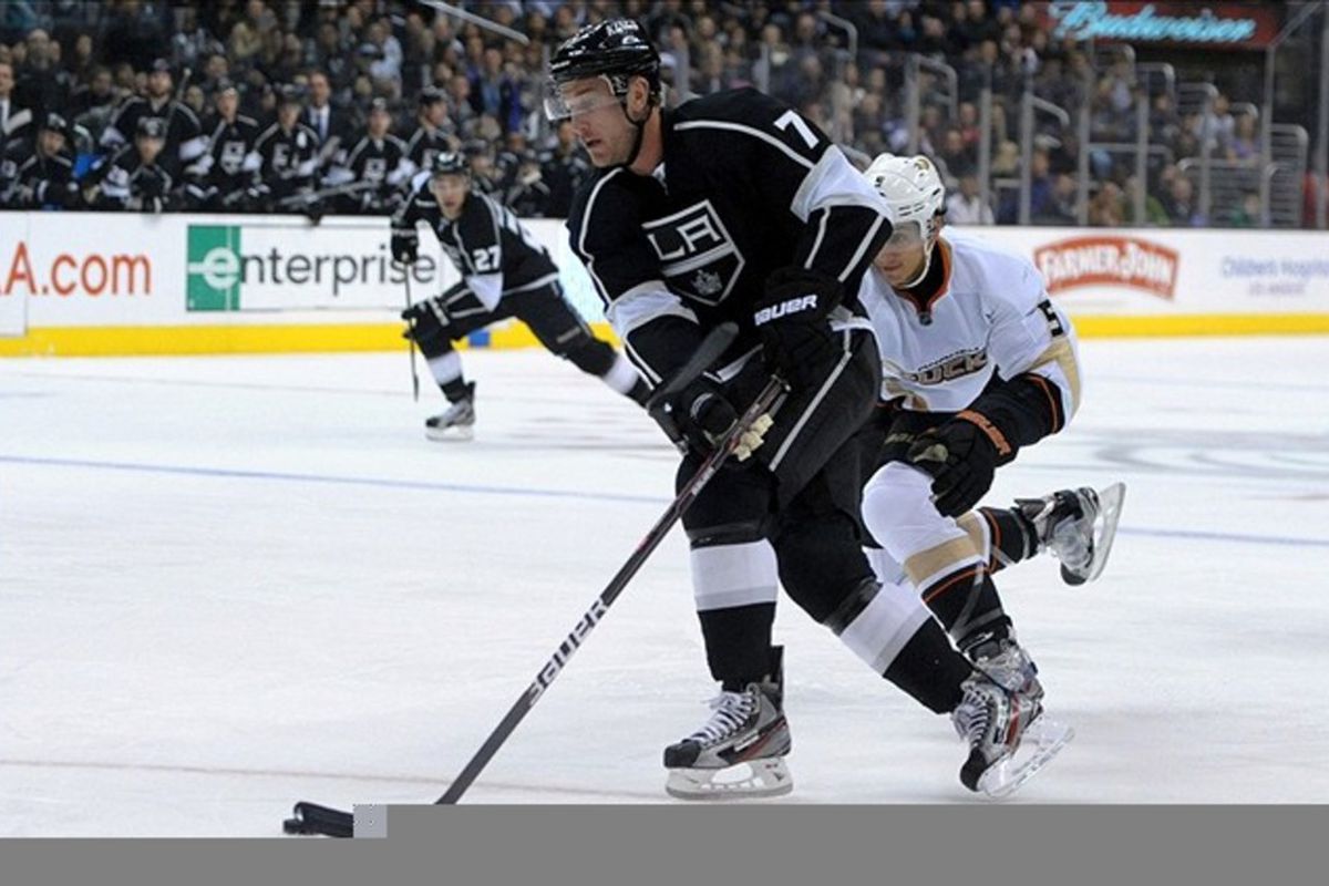 Mar 3, 2012; Los Angeles, CA, USA; Anaheim Ducks defenseman Luca Sbisa (5) defends Los Angeles Kings center Jeff Carter (77) as he skates with the puck in the first period at the Staples Center. Mandatory Credit: Kirby Lee/Image of Sport-US PRESSWIRE