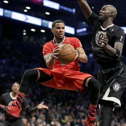 Chicago Bulls' D.J. Augustin, left, passes around Brooklyn Nets' Kevin Garnett during the first half of the NBA basketball game at the Barclays Center Wednesday, Dec. 25, 2013, in New York. 