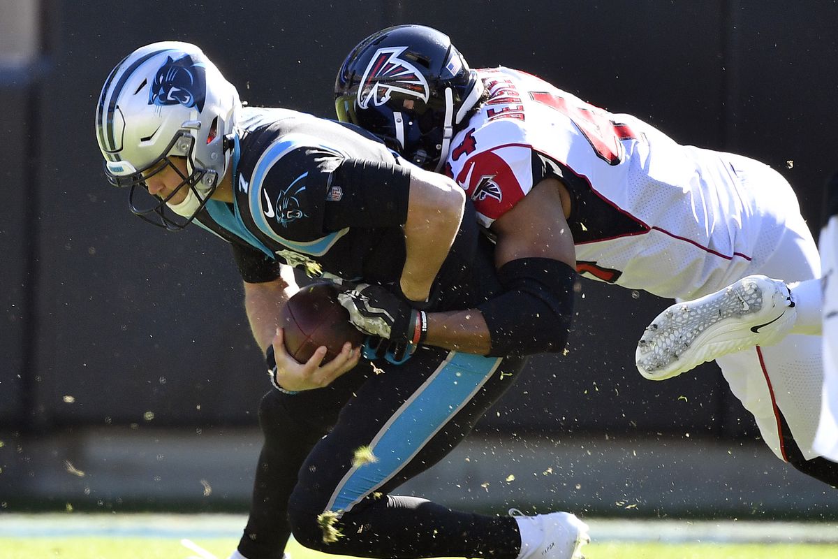 Vic Beasley of the Atlanta Falcons sacks Kyle Allen of the Carolina Panthersduring the first quarter of their game at Bank of America Stadium on November 17, 2019 in Charlotte, North Carolina.