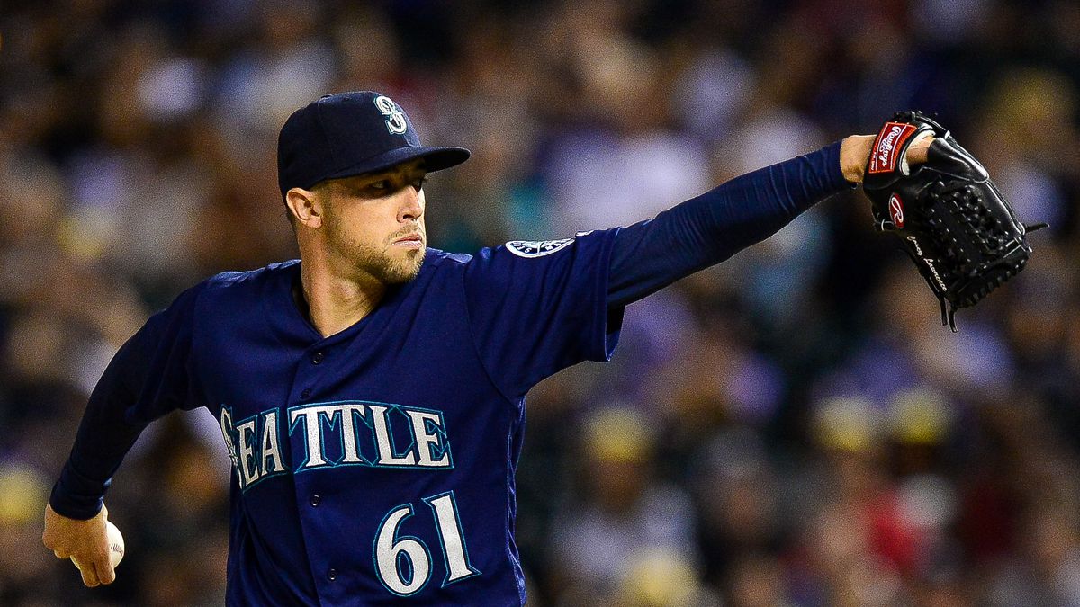 Casey Lawrence #61 of the Seattle Mariners pitches against the Colorado Rockies in the eighth inning of a game at Coors Field on July 13, 2018