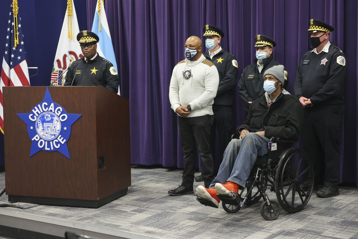 Chicago Police Supt. David Brown, left, speaks about the actions of Officer Adrian McCoy to save Joseph Ortiz during press conference at the Chicago Police Headquarters at 3510 S Michigan Ave in Bronzeville, Thursday, Dec. 23, 2021.