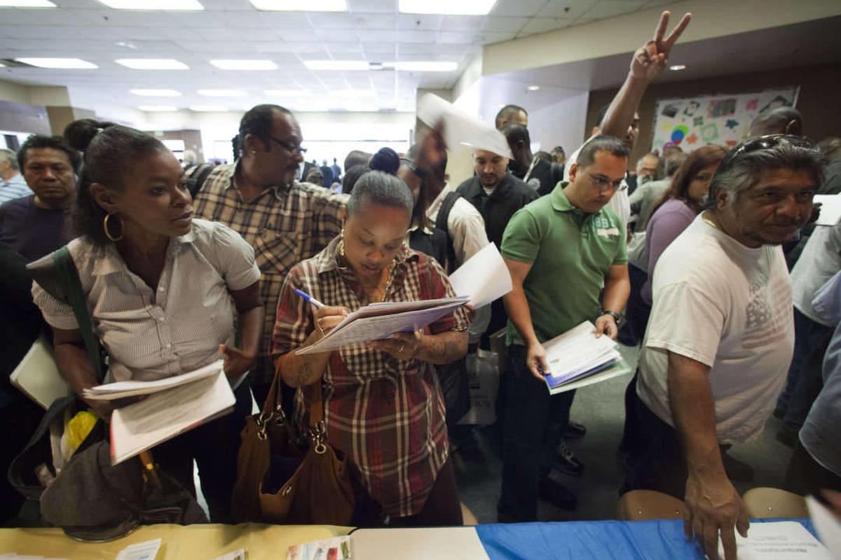 In this Thursday, May 31, 2012, job seekers gather for employment opportunities at the 11th annual Skid Row Career Fair at the Los Angeles Mission in Los Angeles. 